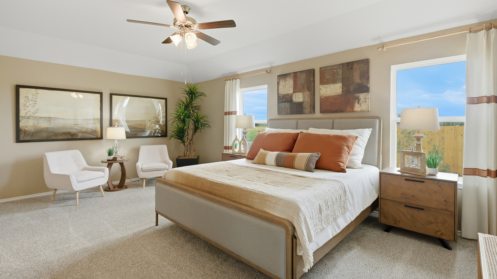 Ranch San Gabriel primary bedroom with carpeted flooring and windows for natural lighting.
