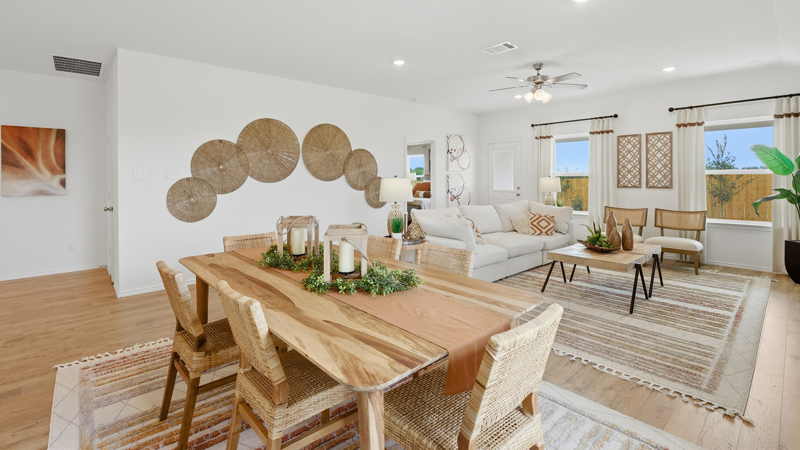 Ranch San Gabriel dining room with view of open concept living room and windows for natural lighting.