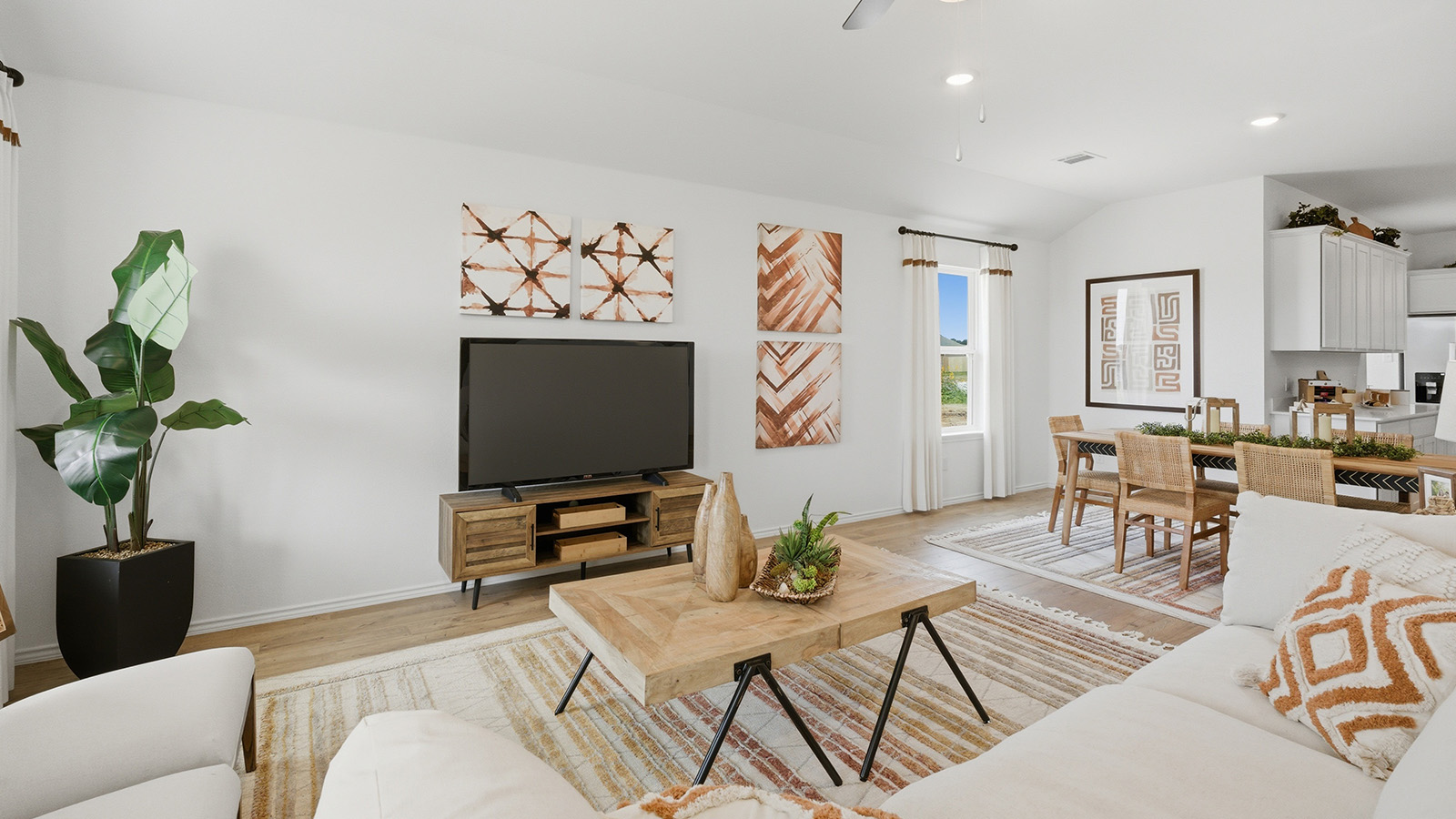 Ranch San Gabriel living room with view of open concept dining room and kitchen.