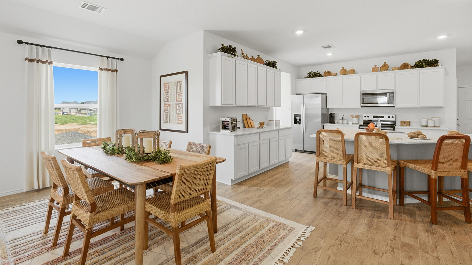 Ranch San Gabriel dining room with window for natural lighting and view of open concept kitchen.