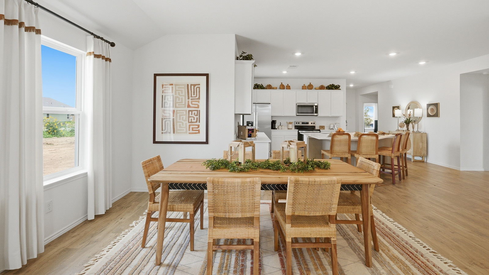 Ranch San Gabriel dining room with window for natural lighting and view of open concept kitchen.