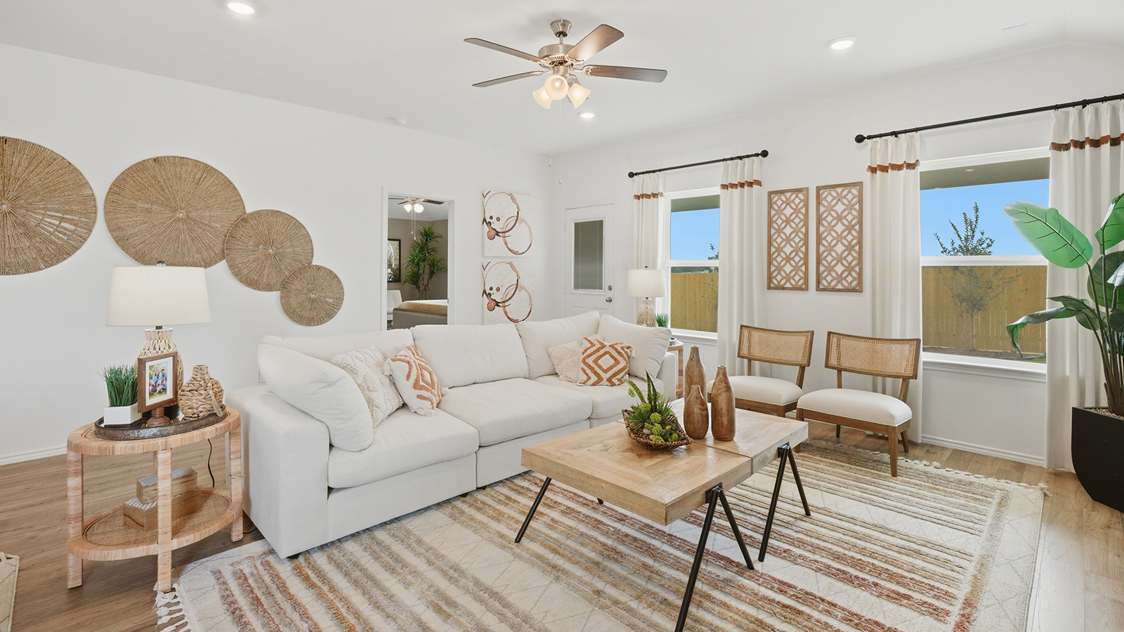 Ranch San Gabriel living room with windows for natural lighting and view of backyard.
