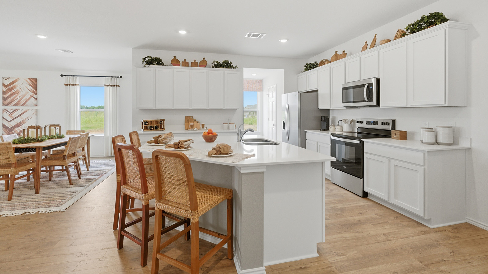 Ranch San Gabriel kitchen with kitchen island and white cabinets and granite countertops.
