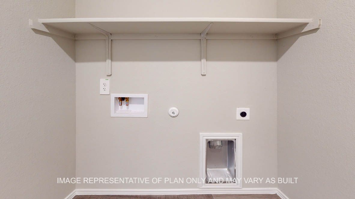 Elgin utility room with storage shelf.