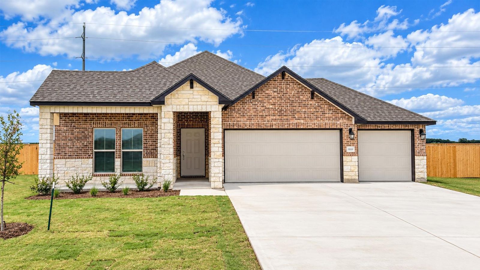 Monroe Front Exterior X Elevation with 3 car garage.