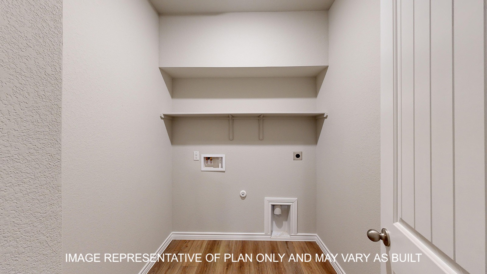 Monroe utility room with vinyl plank flooring and storage shelves.