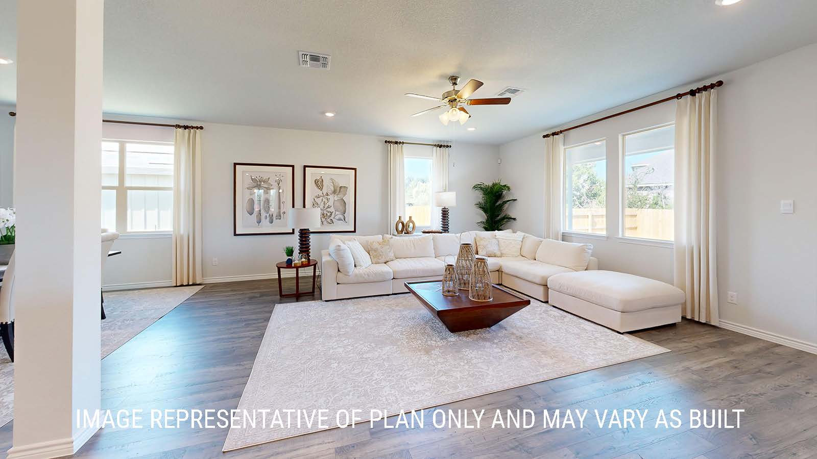 Newburgh living room with windows for lighting and view of back yard.