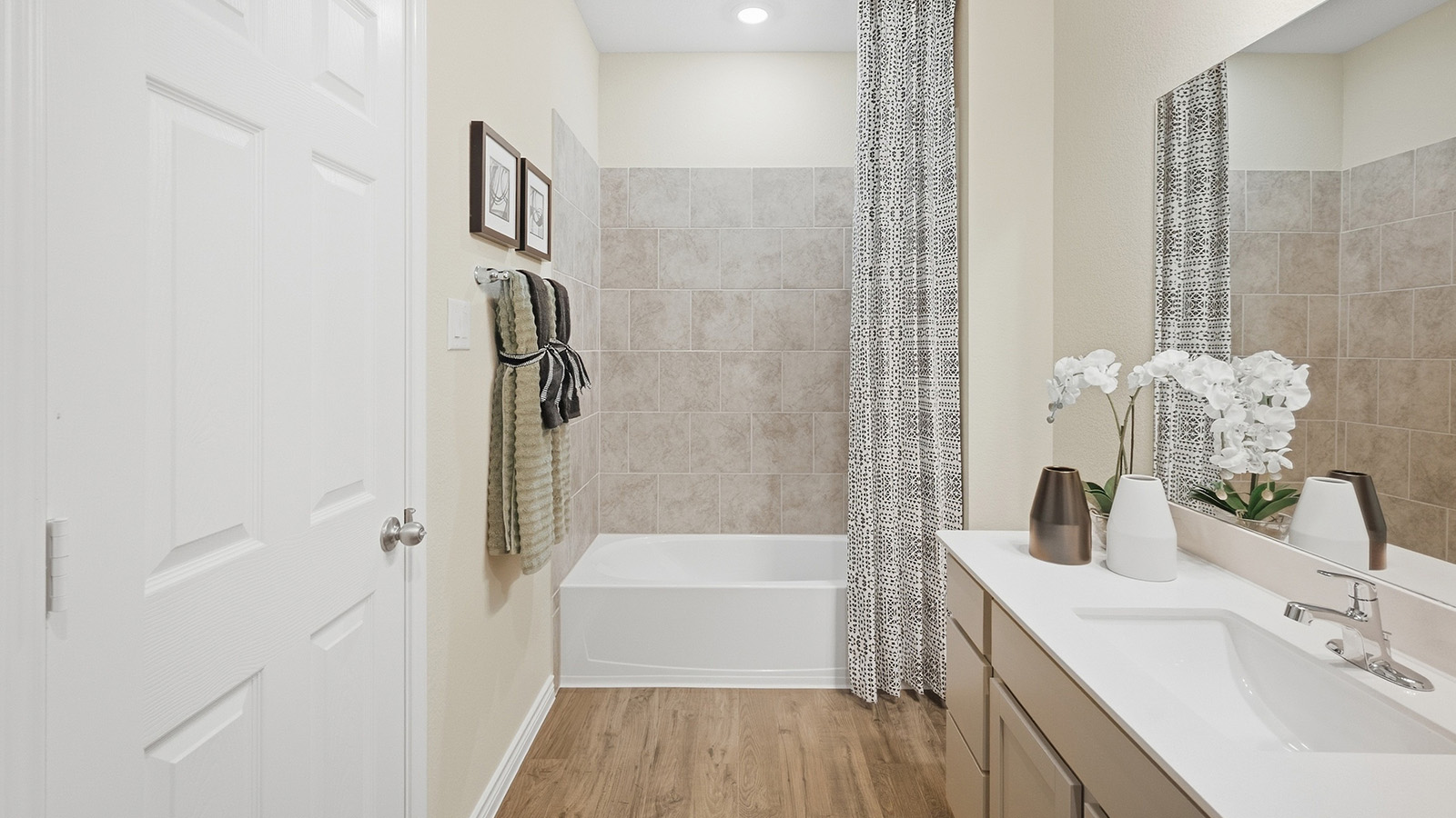 Homestead Model secondary bathroom with vanity sink and shower and tub combo.