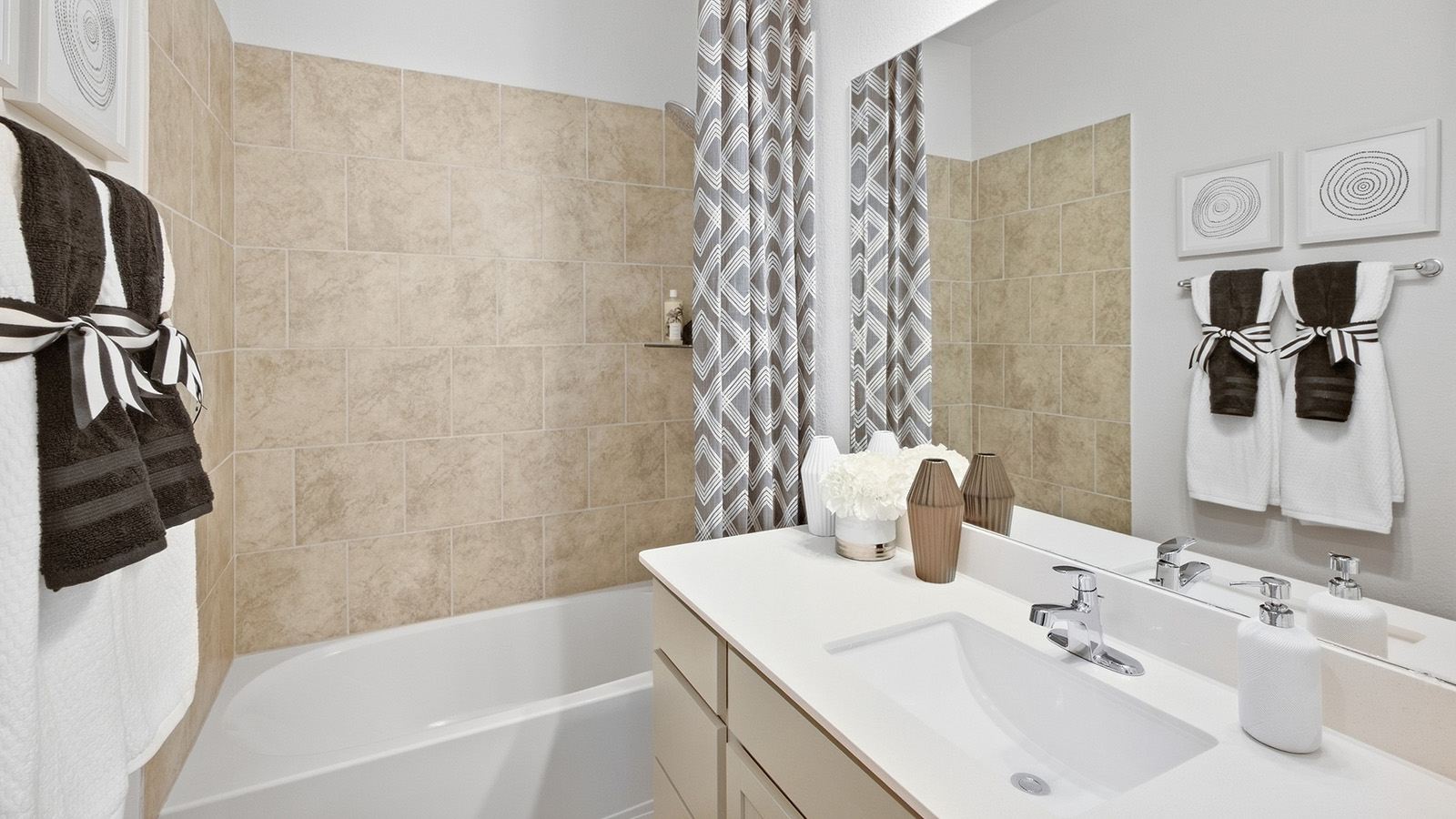 Homestead Model secondary bathroom with vanity sink and shower and tub combo.