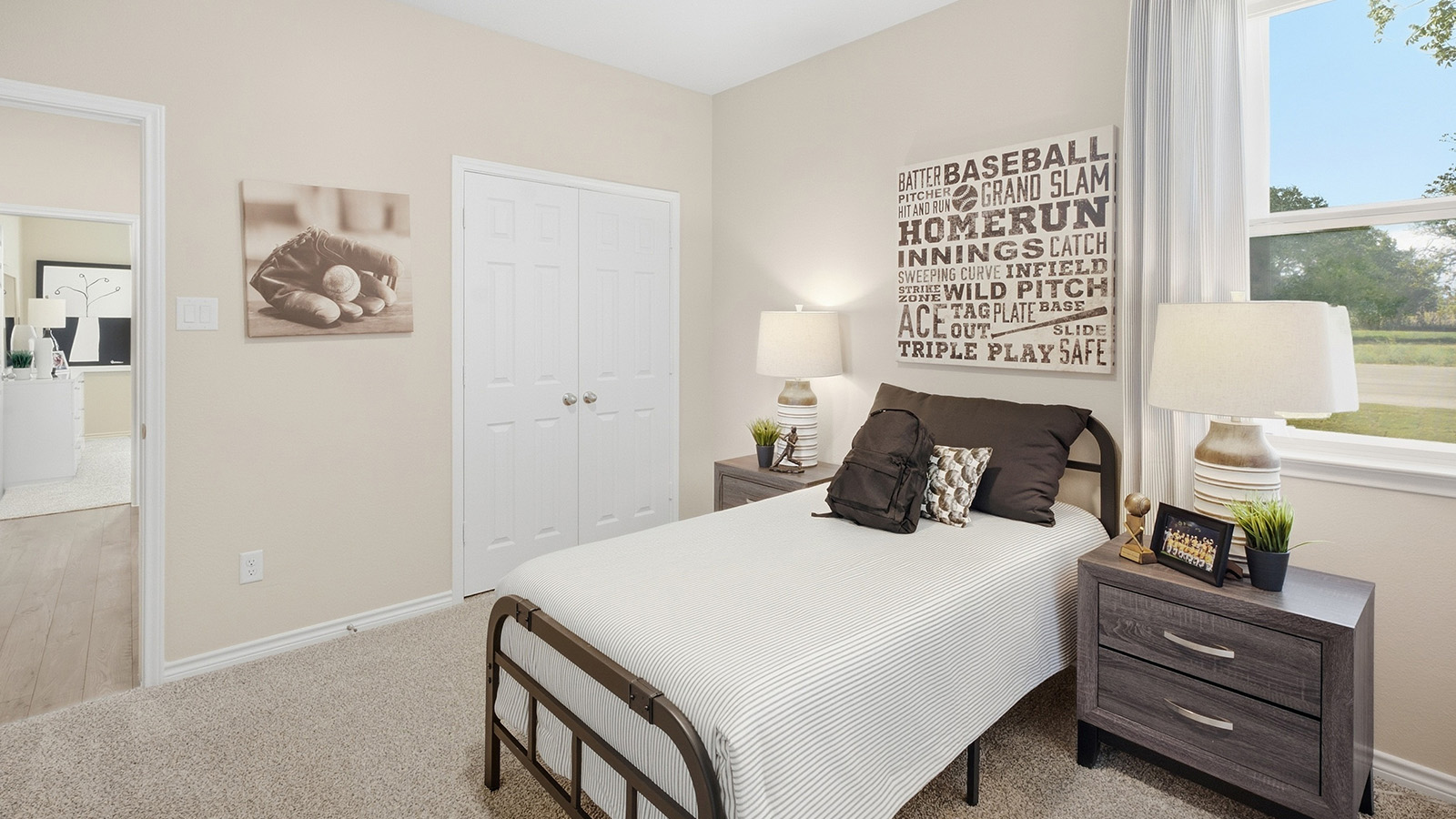 Homestead Model secondary bedroom with carpeted flooring and window for natural lighting.