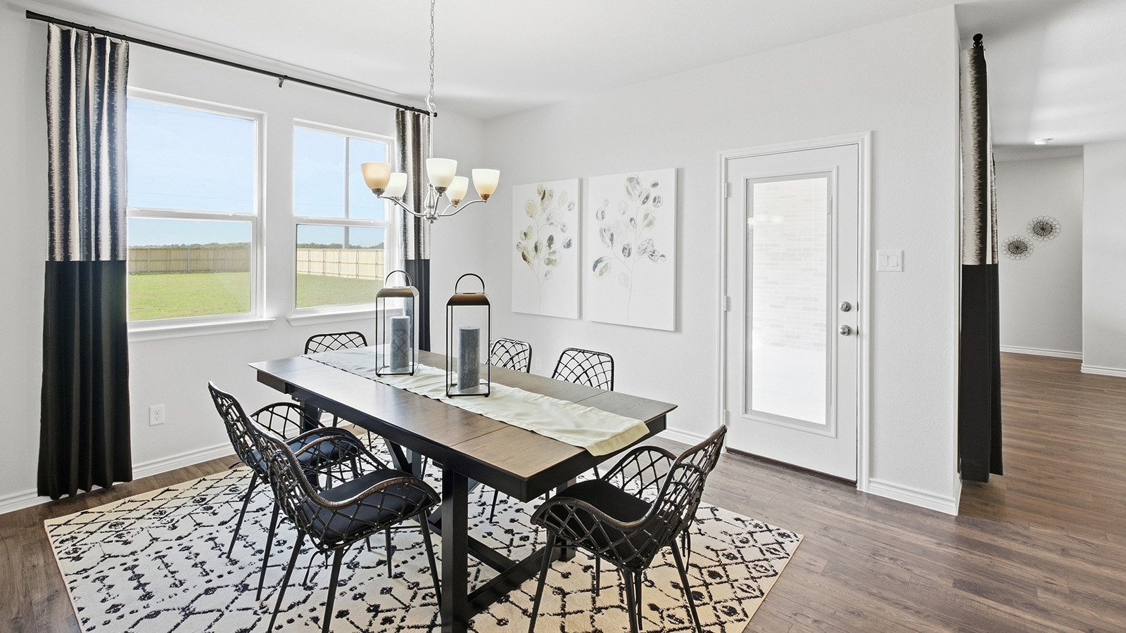Homestead Model dining room with dining room table and windows for natural lighting.