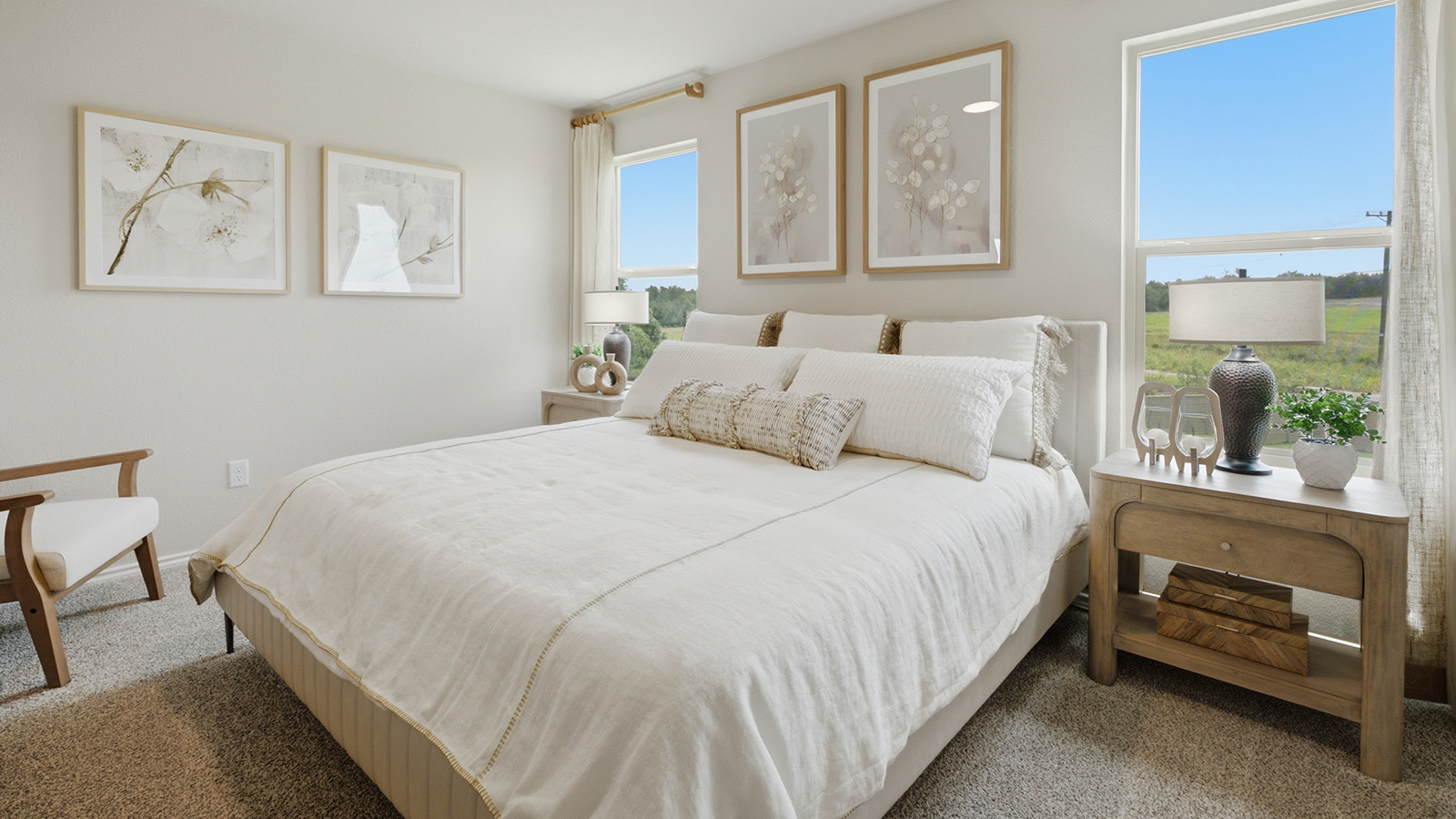 Cool Water model primary bedroom with carpeted flooring and windows for natural lighitng.