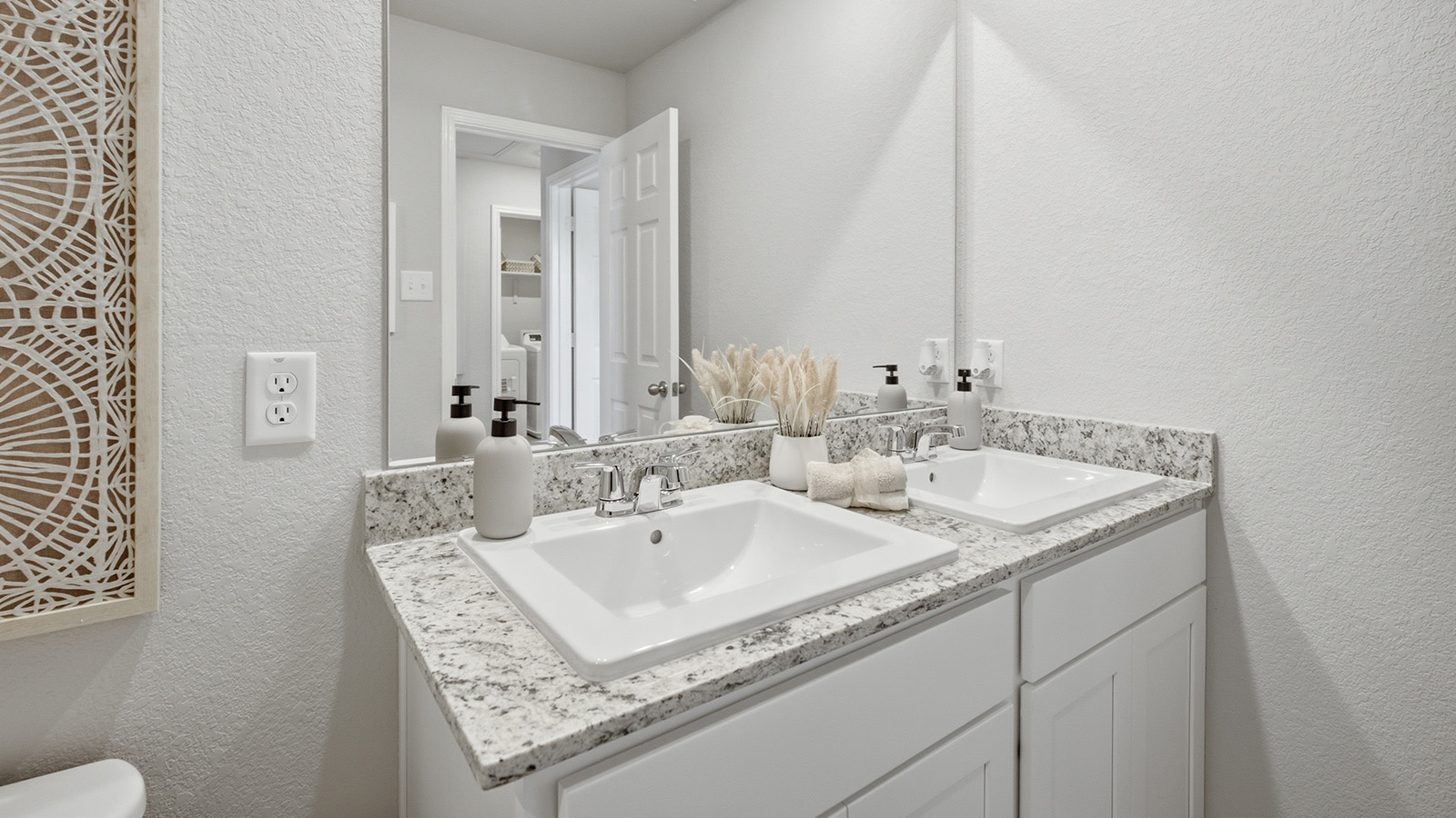 Cool Water model secondary bathroom with duel vanity sink and with granite countertops.