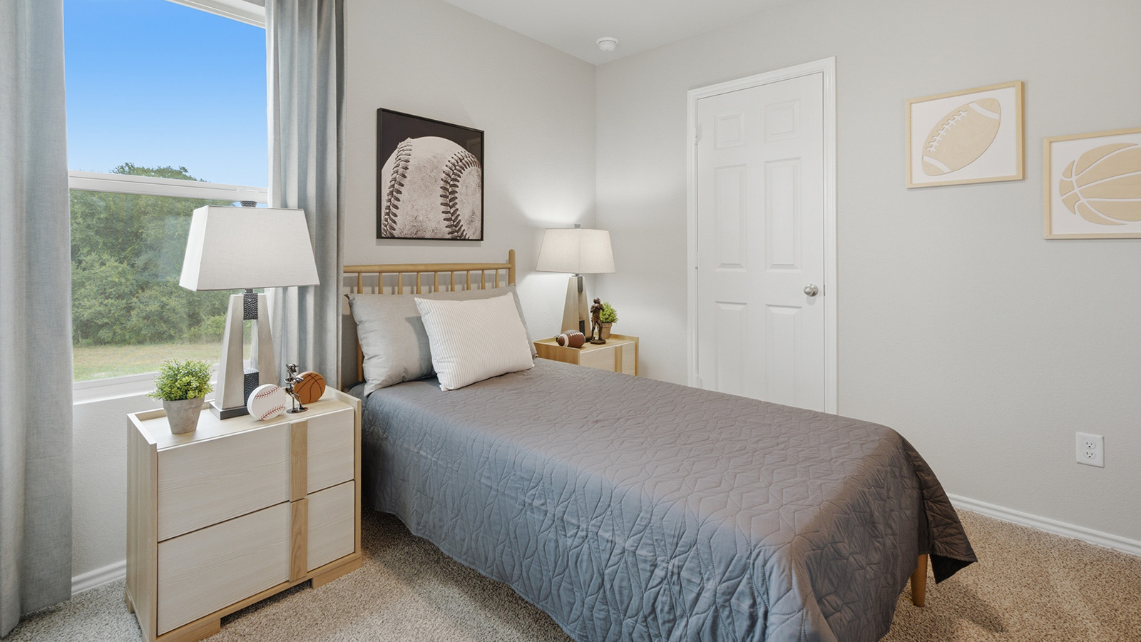 Cool Water model secondary bedroom with carpeted flooring and window for natural lighting.