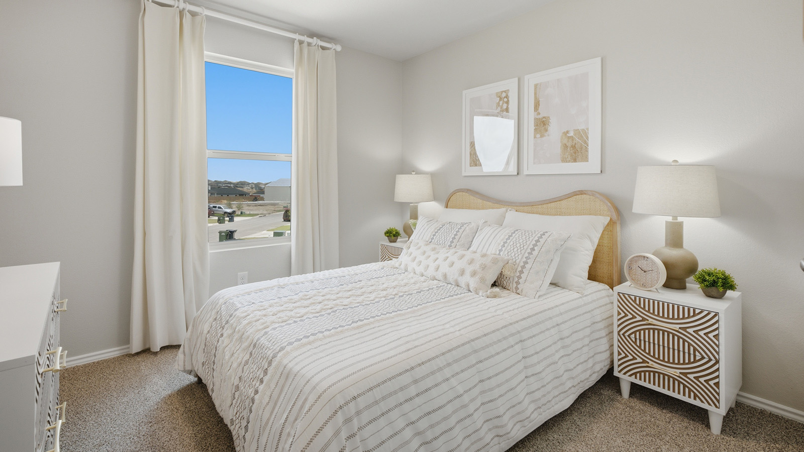 Cool Water model secondary bedroom with carpeted flooring and window for natural lighting.