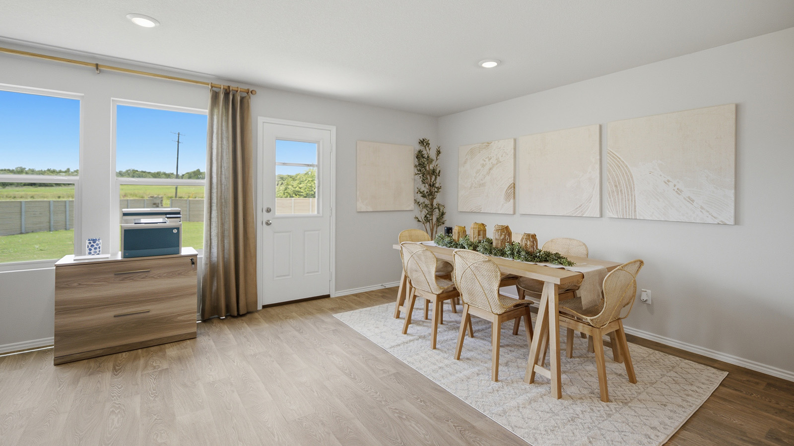 Cool Water model home dining room with view of open concept kitchen.