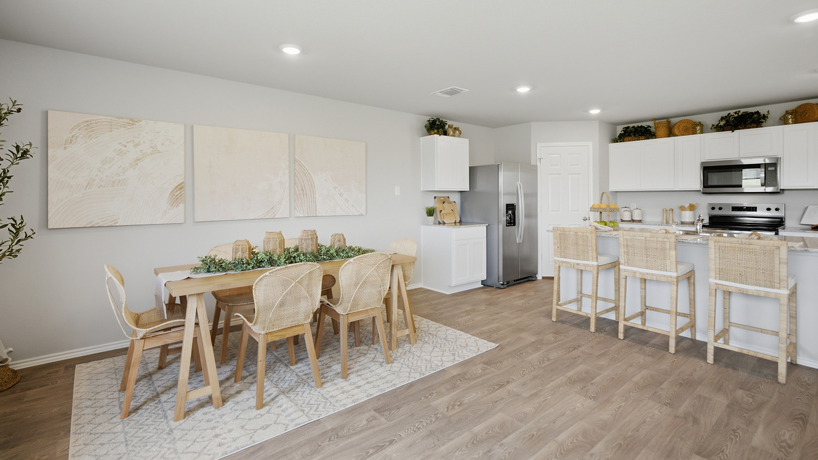 Cool Water model home dining room with view of open concept kitchen.