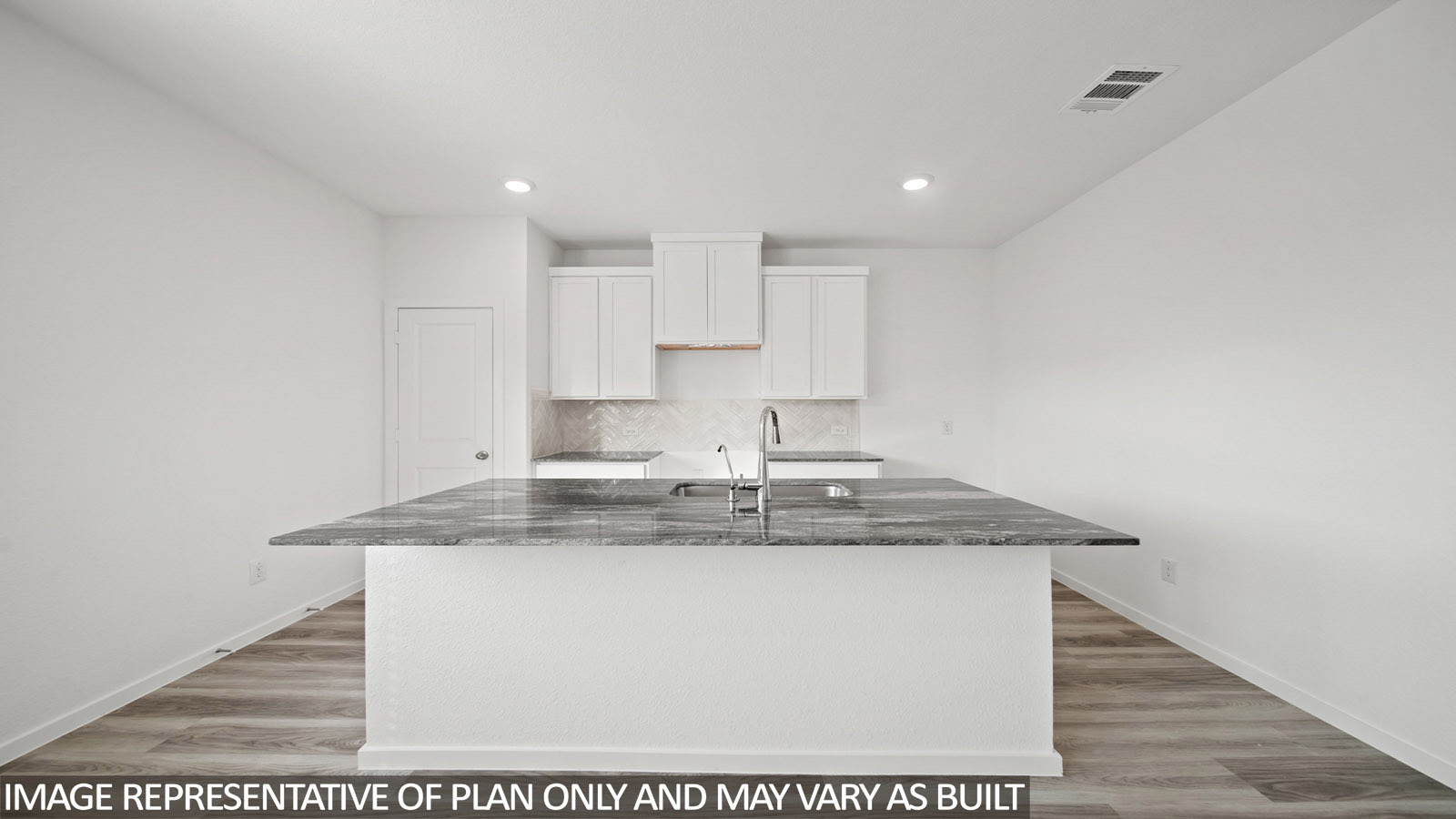 Gardenia kitchen with kitchen island and light cabinets and dark countertops.