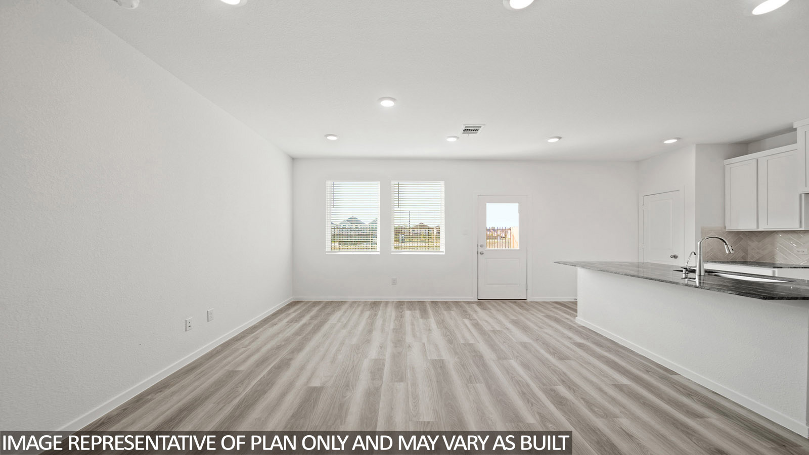 Gardenia living room with vinyl plank flooring and view of open concept dining room and kitchen.