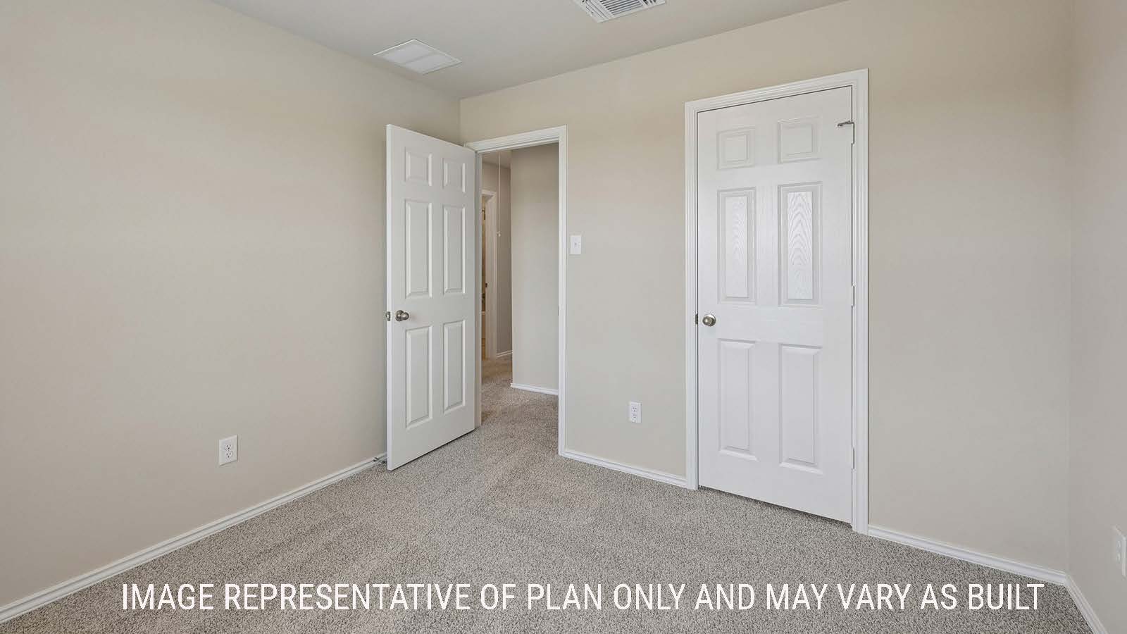 Gardenia secondary bedroom with carpeted flooring and view of hallway.