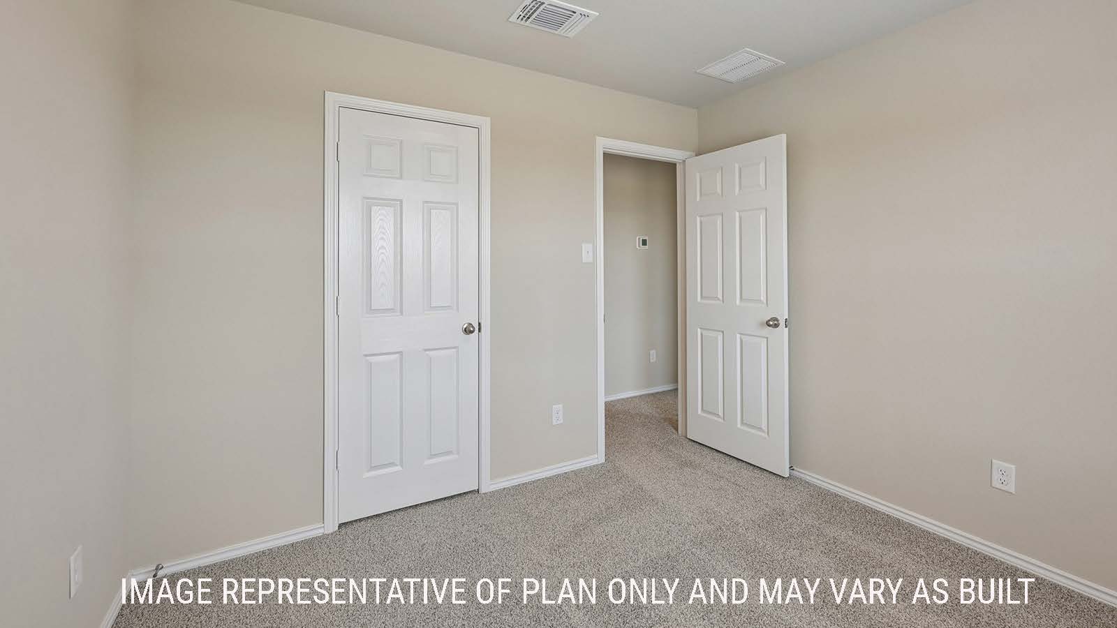 Gardenia secondary bedroom with carpeted flooring and view of hallway.