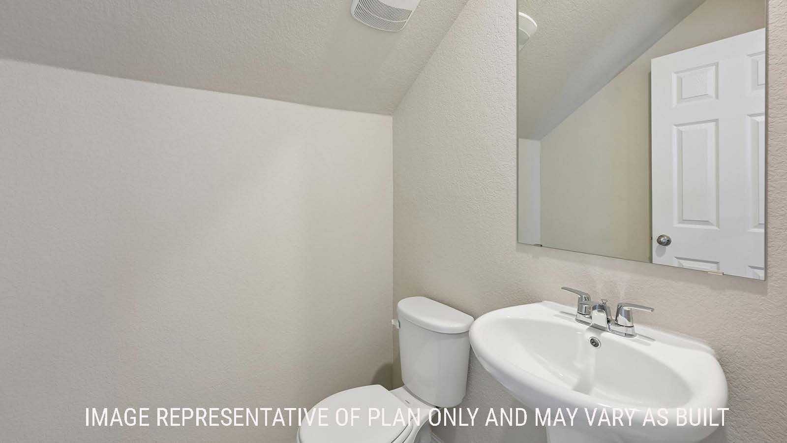 Gardenia half bath with sink and mirror.