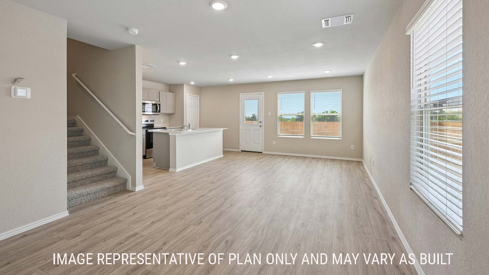 Gardenia dining room with view of open concept kitchen and living room.