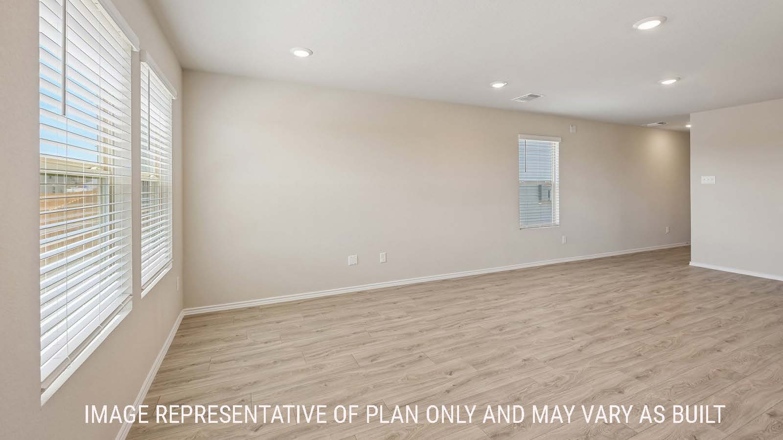 Gardenia dining room with view of front entry hallway and windows for natural lighting.
