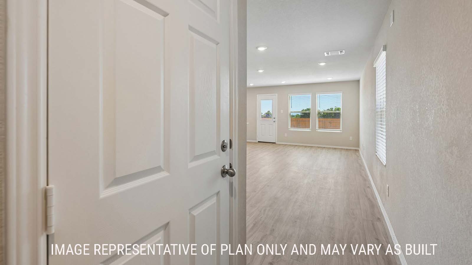 Gardenia front entry hallway with view of open concept kitchen and dining room.