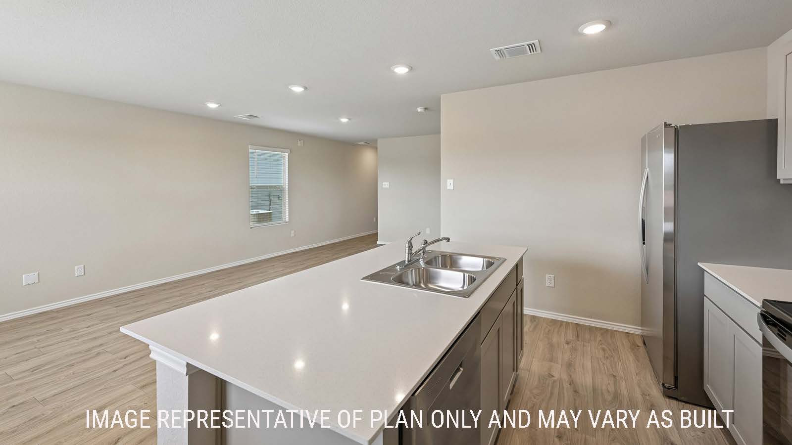 Gardenia kitchen with kitchen island with view of open concept dining room and living room.