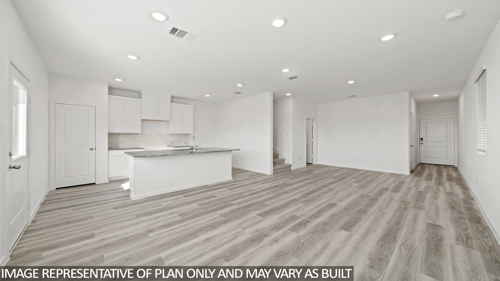 Gardenia dining room with vinyl plank flooring and view of open concept of living room and kitchen.