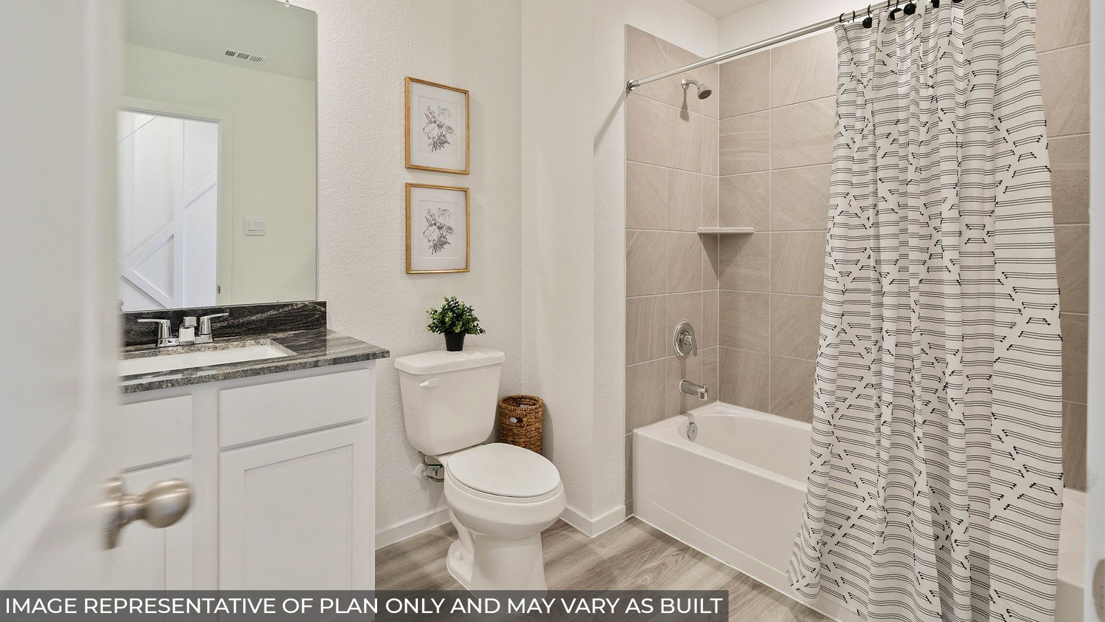Hibiscus secondary bathroom with vanity sink and shower and tub combo.