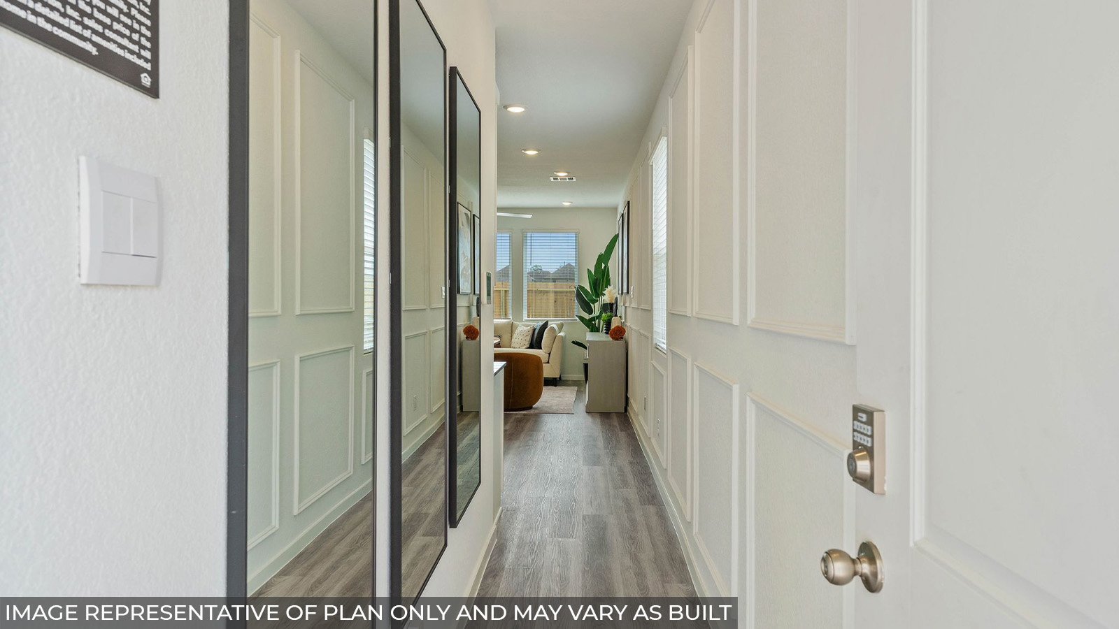 Hibiscus front entry way with vinyl plank flooring and view of open concept living room.