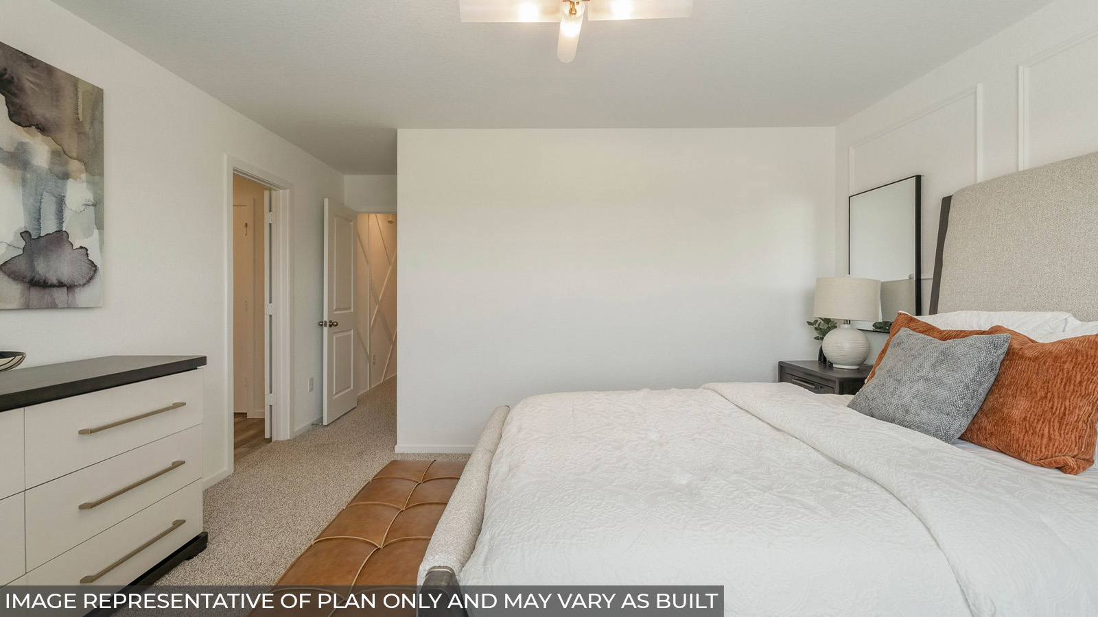 Hibiscus primary bedroom with carpeted flooring and view of primary bathroom.