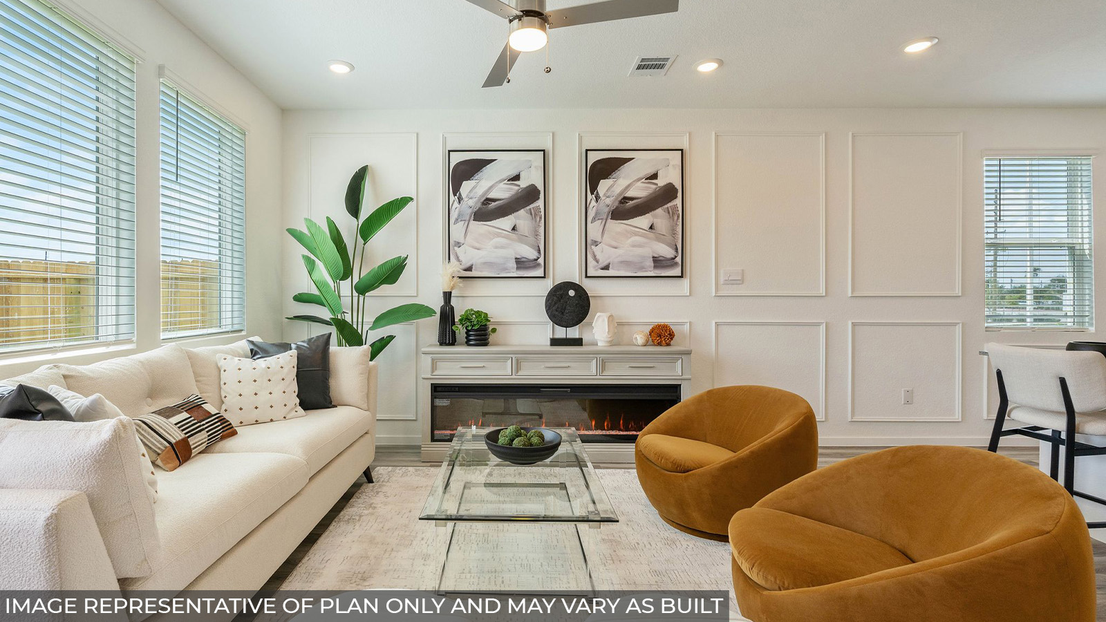 Hibiscus living room with vinyl plank flooring and windows for natural lighting.