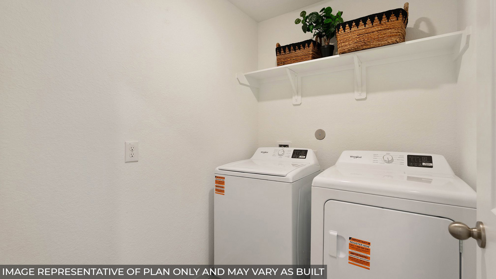 Hibiscus utility room with washer and dryer and shelving for storage.