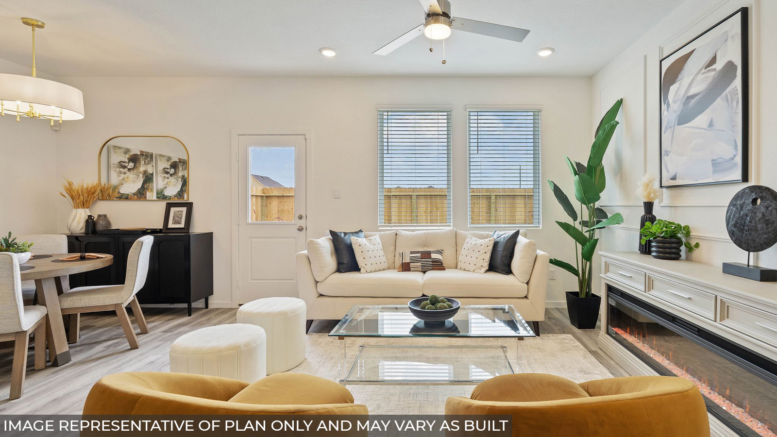 Hibiscus living room with vinyl plank flooring and windows with view of back yard.