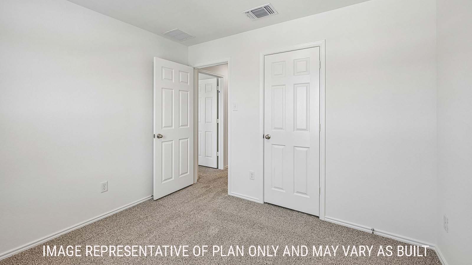 Hibiscus secondary bedroom with carpeted flooring and view of hallway.