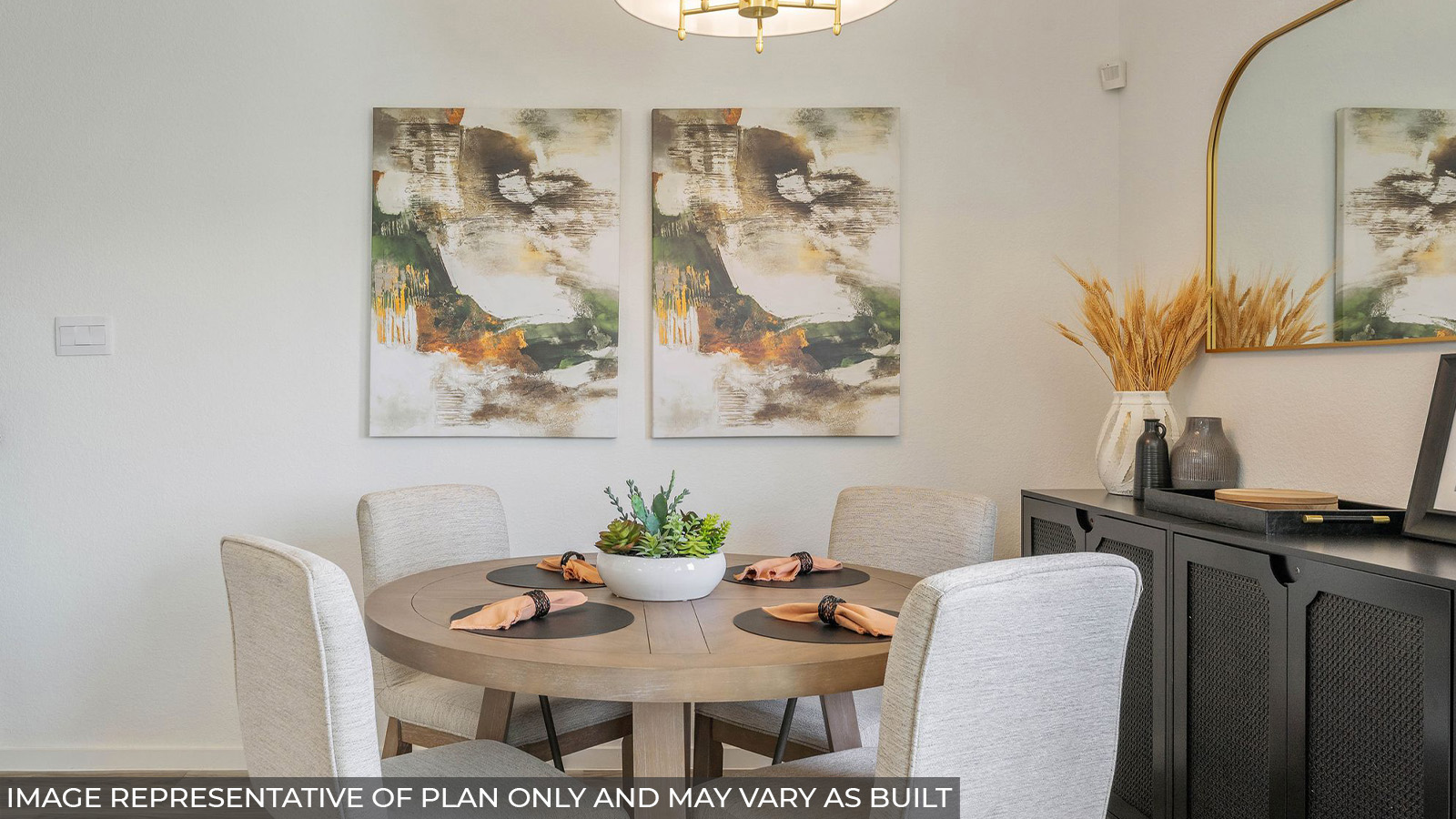 Hibiscus dining room with vinyl plank flooring and kitchen table and dark cabinets.