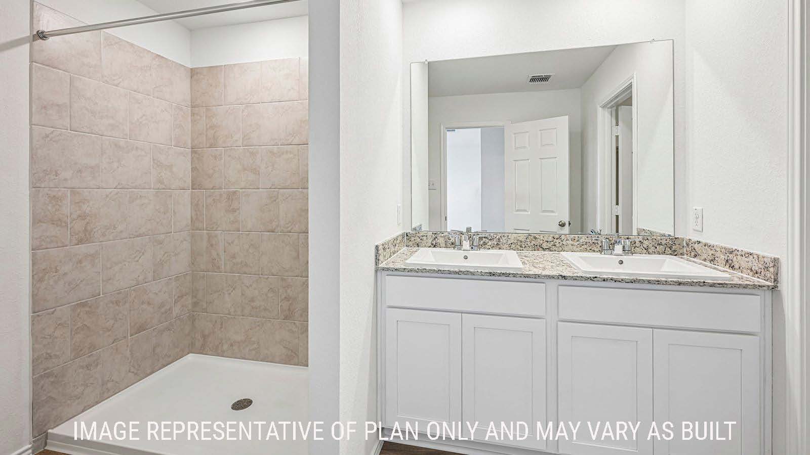 Hibiscus primary bathroom with double vanity sink and walk-in shower.