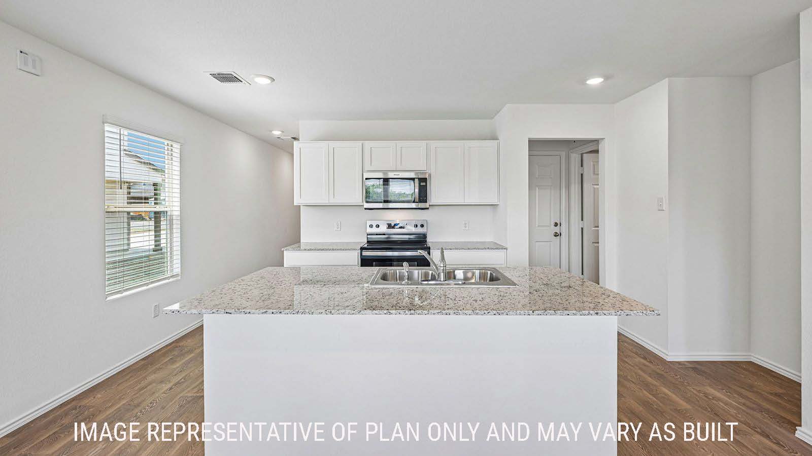 Hibiscus kitchen with kitchen island and light cabinets and granite countertops.