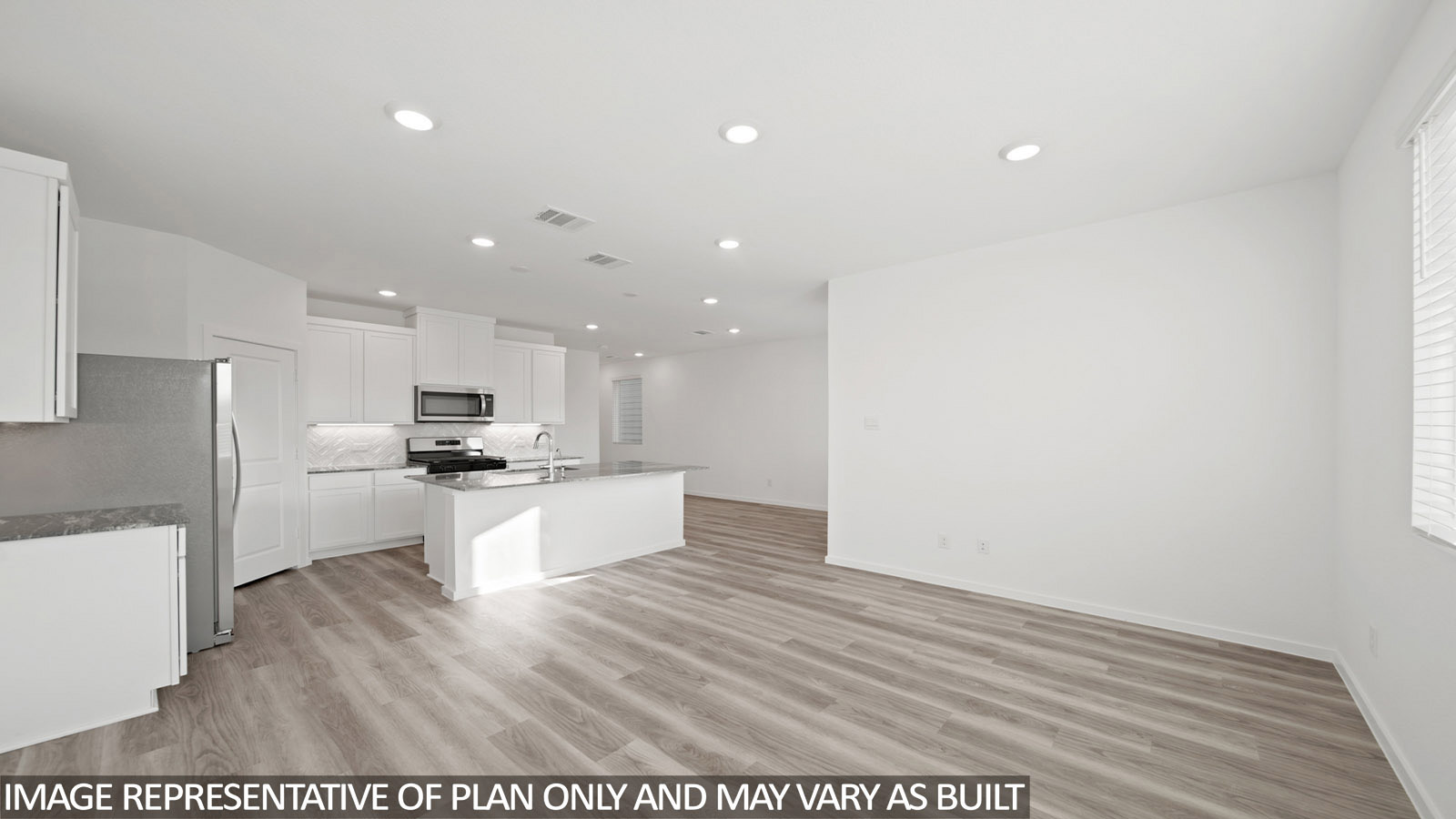 Iris living room with vinyl plank flooring and view of open concept kitchen and dining room.