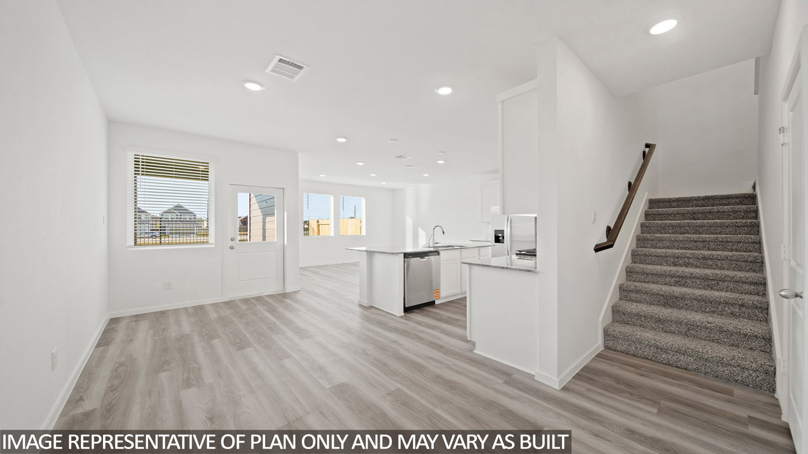 Iris living room with vinyl plank flooring and view of open concept kitchen and dining room.