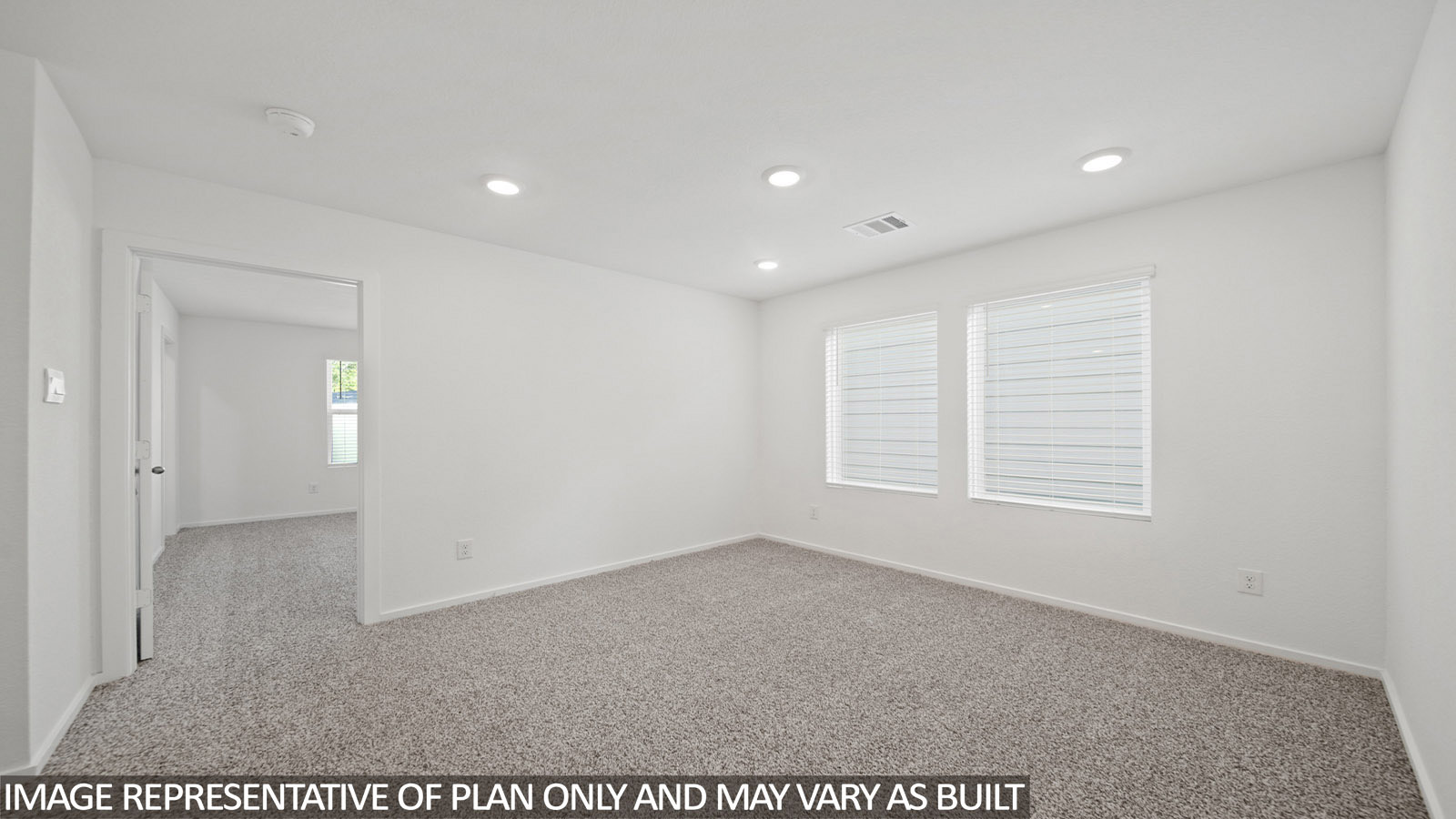 Iris game room with carpeted flooring and view of primary bedroom.