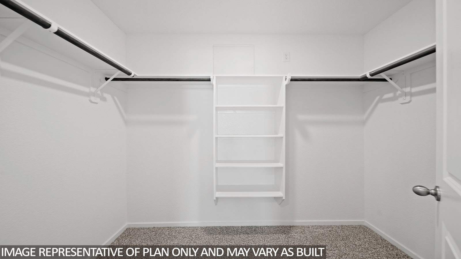Iris primary bedroom walk-in closet with carpeted flooring and shelving for storage.