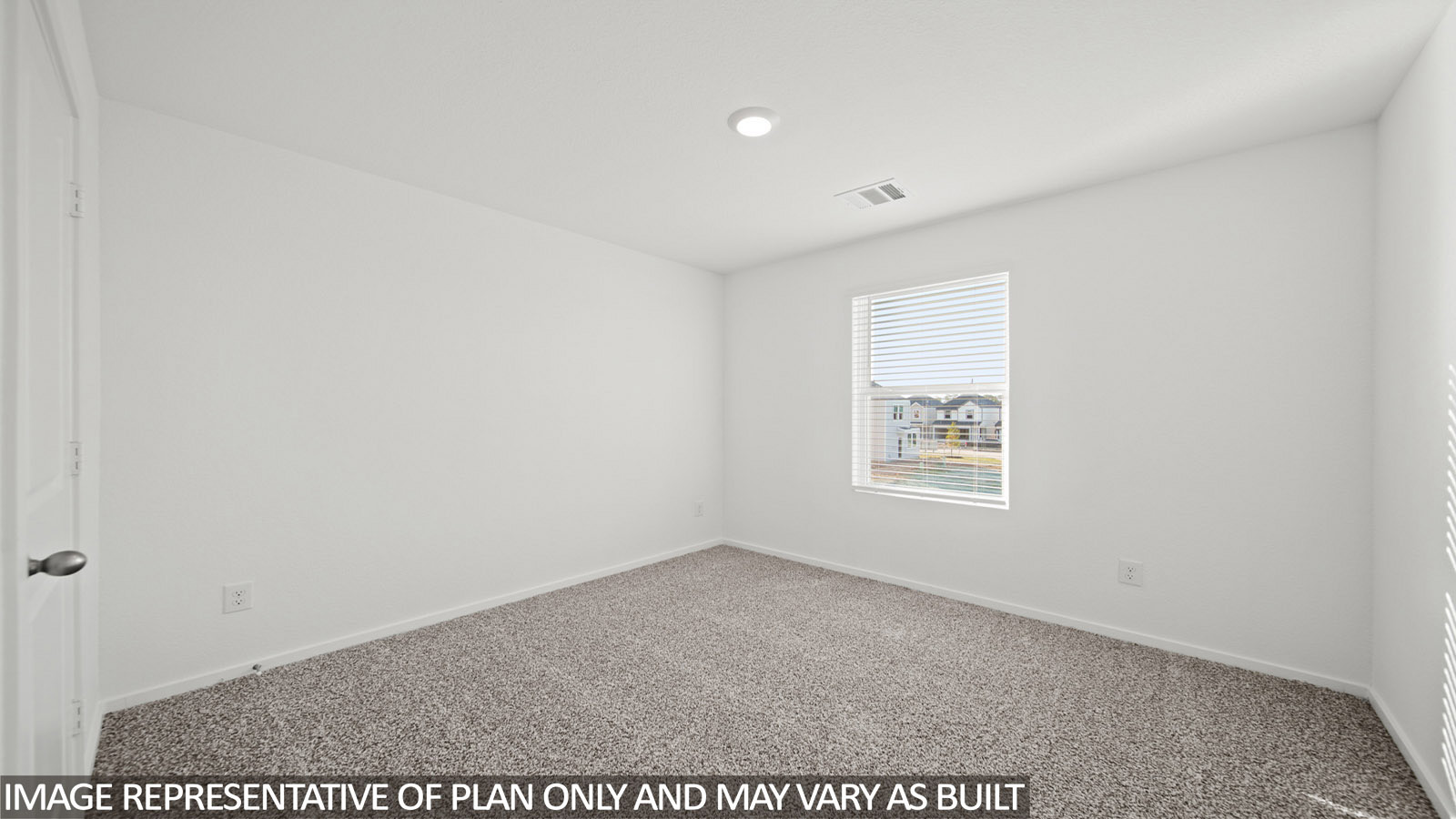 Iris secondary bedroom with carpeted flooring and window for natural lighting.