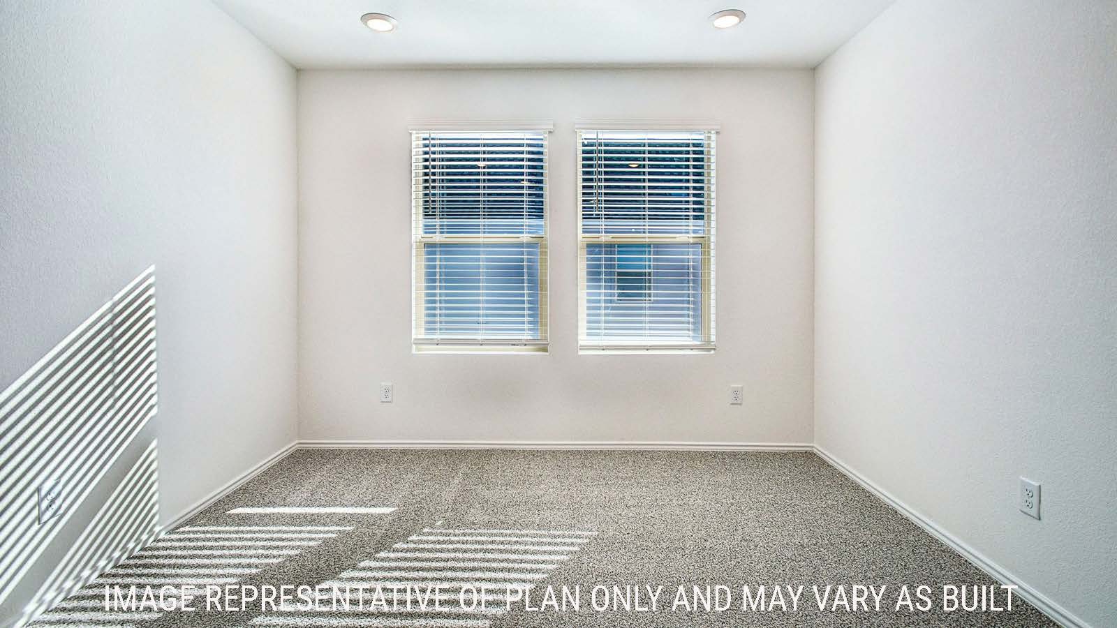 Iris game room with carpeted flooring and windows for natural lighting.