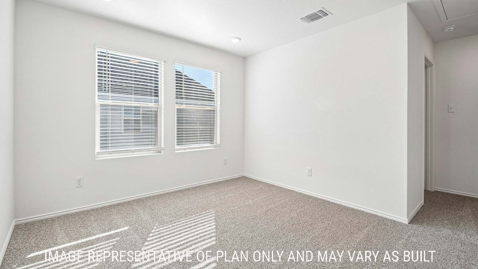 Iris game room with carpeted flooring and windows for natural lighting.