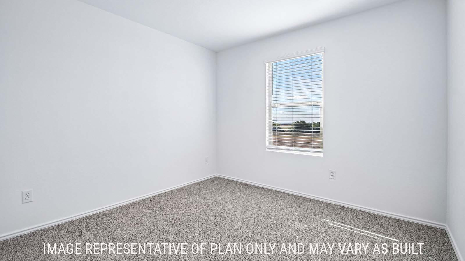 Iris secondary bedroom with carpeted flooring and window for natural lighting.