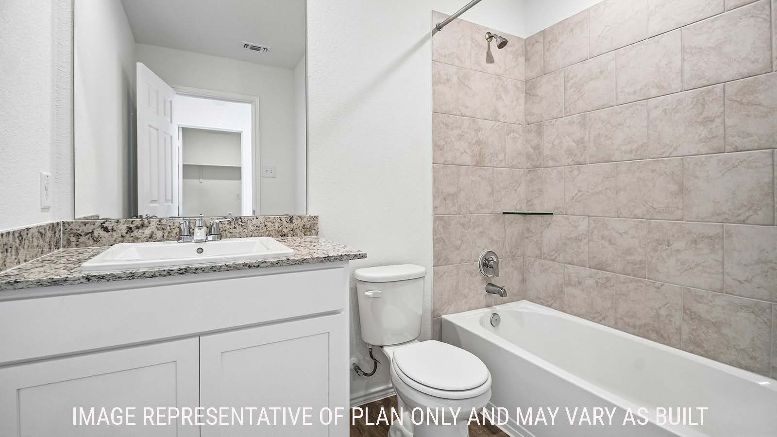 Iris secondary bathroom with vanity sink and shower and tub combo.